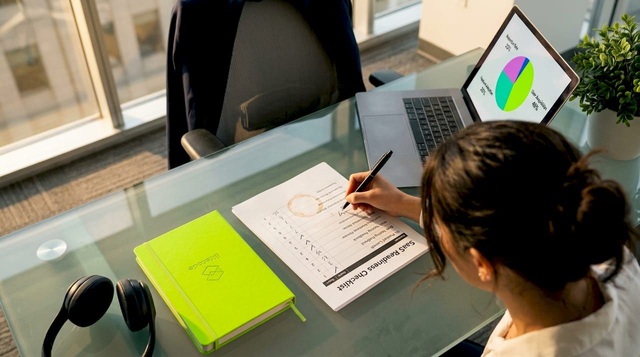 Woman scoring SaaS readiness checklist