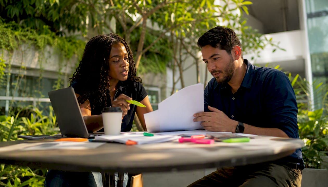 Consultants collaborating over enterprise plans