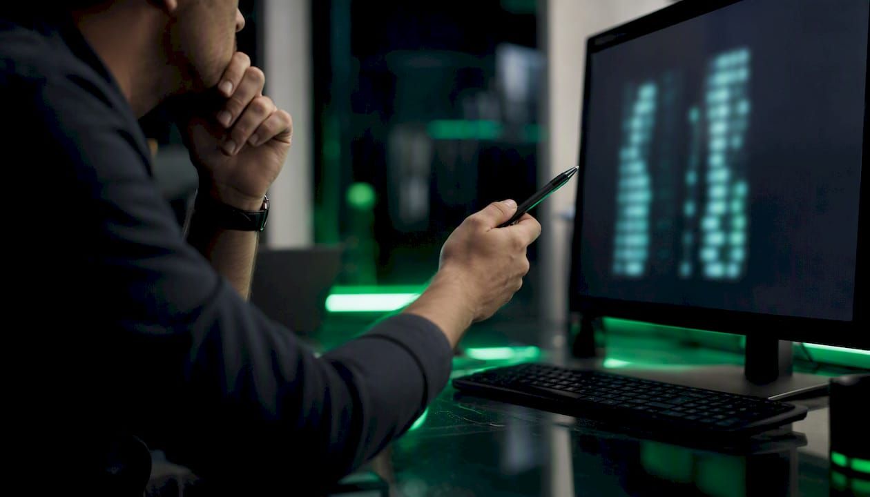 Hands reviewing transaction data logs